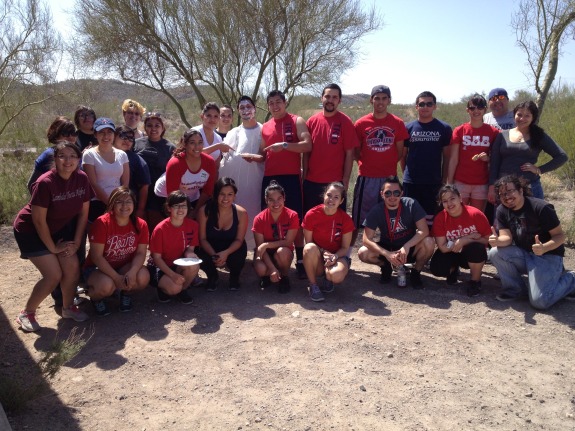 Group picture of trio students after cleaning the park.